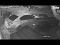 Moment car bursts into flames after hooded arsonists target politician's home