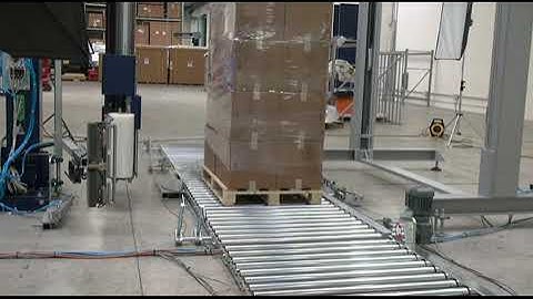 Rototech 3000 rotating arm stretch wrapper with floor level conveyor