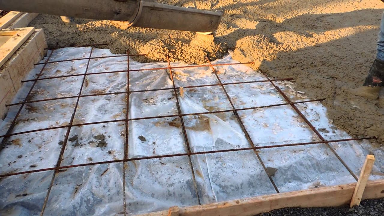 How do you pour a concrete floor in a garage?