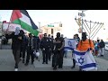 Clashes as propalestine protesters march through jewish neighborhood circling menorahs  nyc