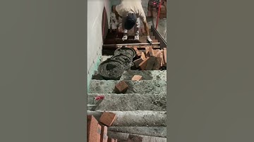 the process of installing red bricks on the stairs of a building #construction #popular #viralshorts