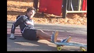 james stacks down slide on longboard