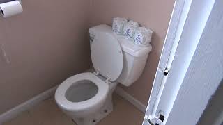 An assortment of Vintage Toilets in an Executive Office Building in St. Charles MO with elevator