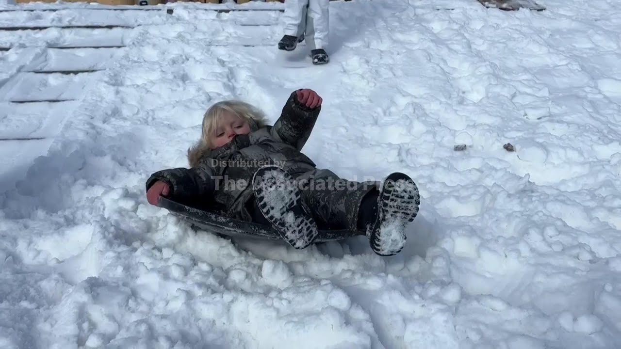 People play in the cold as Northeast sees more snow from the tail end ...