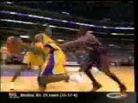 Kobe Bryant dunks over Yao Ming