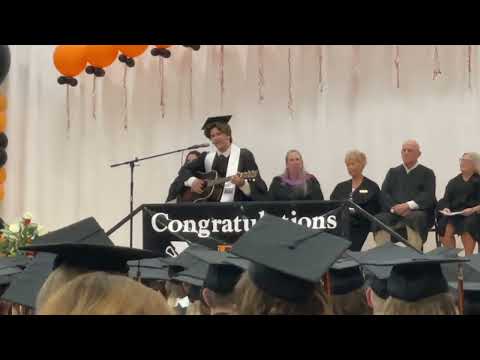 Ben Moore from Flathead High School at his 2024 Graduation singing "Stop This Train" by John Mayer