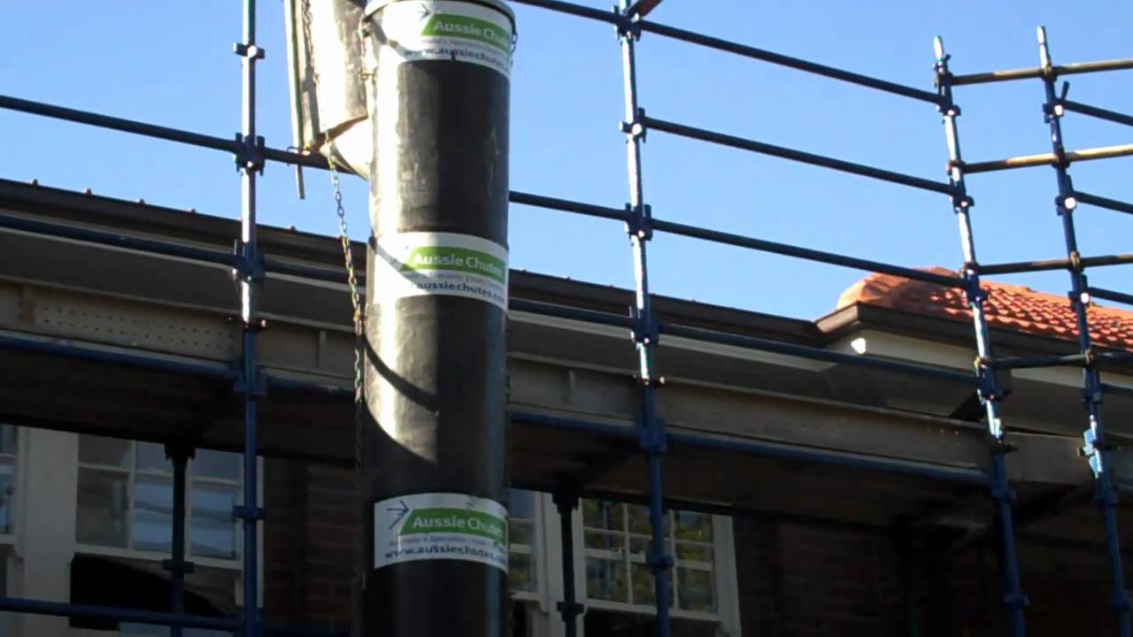 Construction rubbish chutes used to remove old tiles off roof the easy