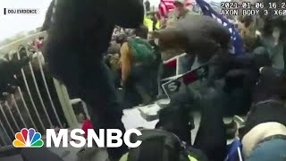 FBI Releases New Video Of Officers Dragged Into Crowd During Capitol Riot