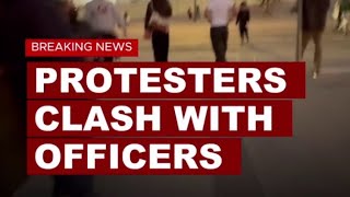 Protesters clash with officers near federal building in downtown LA