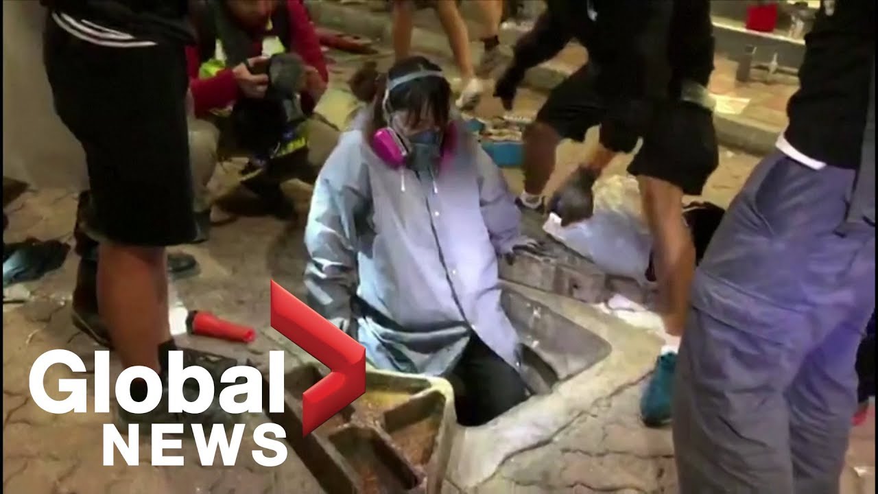 Hong Kong protesters seek escape routes from besieged university campus