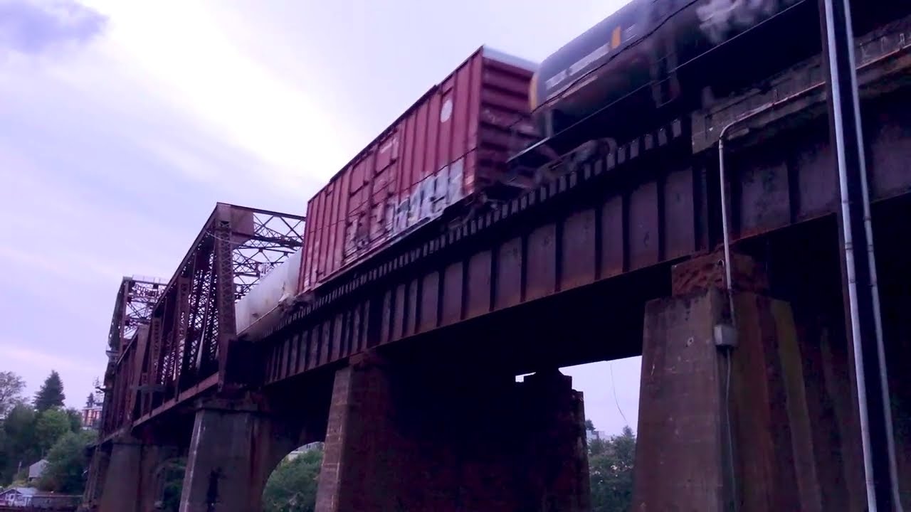Freight train traveling over bridge near Ballard Locks