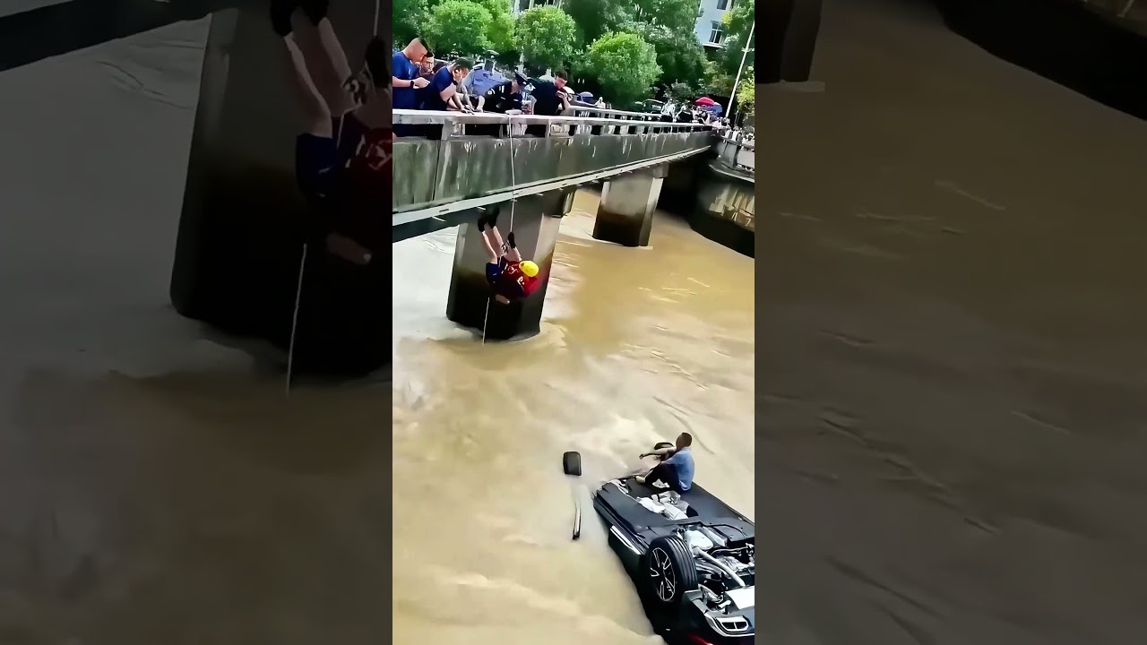 Life - or - Death Race! Car Swept Away by Flood, Rescuers Risk Lives to Descend Bridge for Rescue