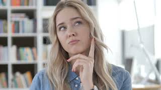 young woman thinking at work