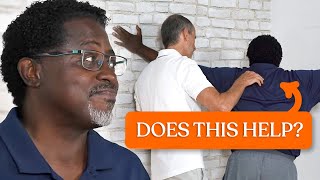 Eddie tries Roland's shoulder exercises for the first time