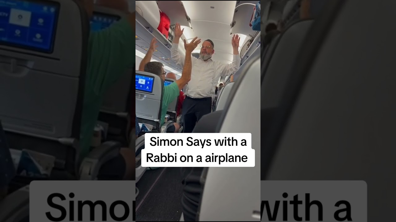 Rabbi Nosson Neuberger entertaining a delayed plane with a game of Simon Says