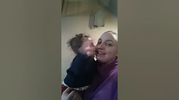 My baby, my 7 month old son giving me kisses.