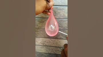 Slow motion of piercing water balloon