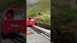Old fashioned cute cogwheel train Switzerland