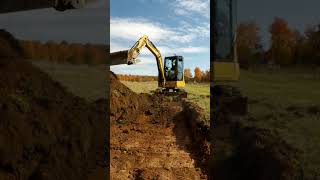 Cat 304 Excavator digging 48 inch bucket