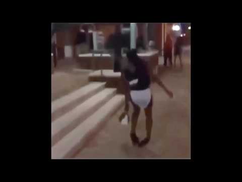 Pretty Girl struggles to walk in high heels and almost falls on the street