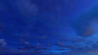 ( CGI 4k Stock Footage ) Dark blue night clouds on stary sky time lapse seamless loop