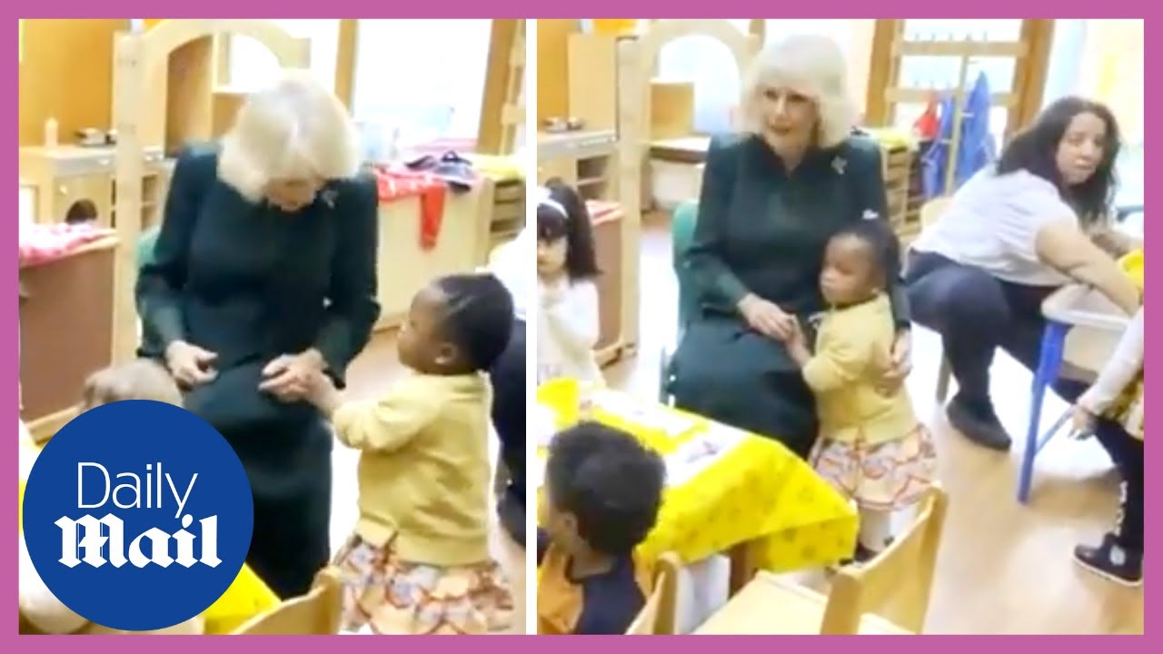 Cute moment Queen Consort Camilla gets a hug from a toddler at nursery