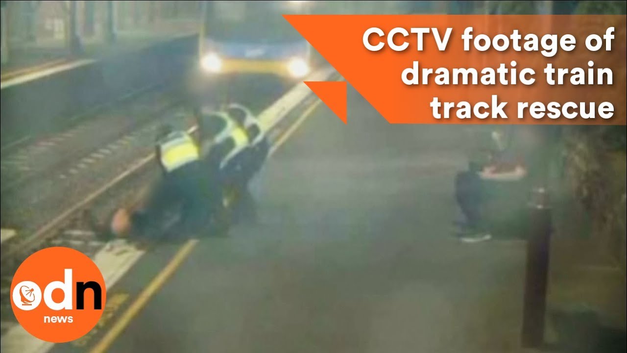 CCTV footage captures dramatic train track rescue - YouTube