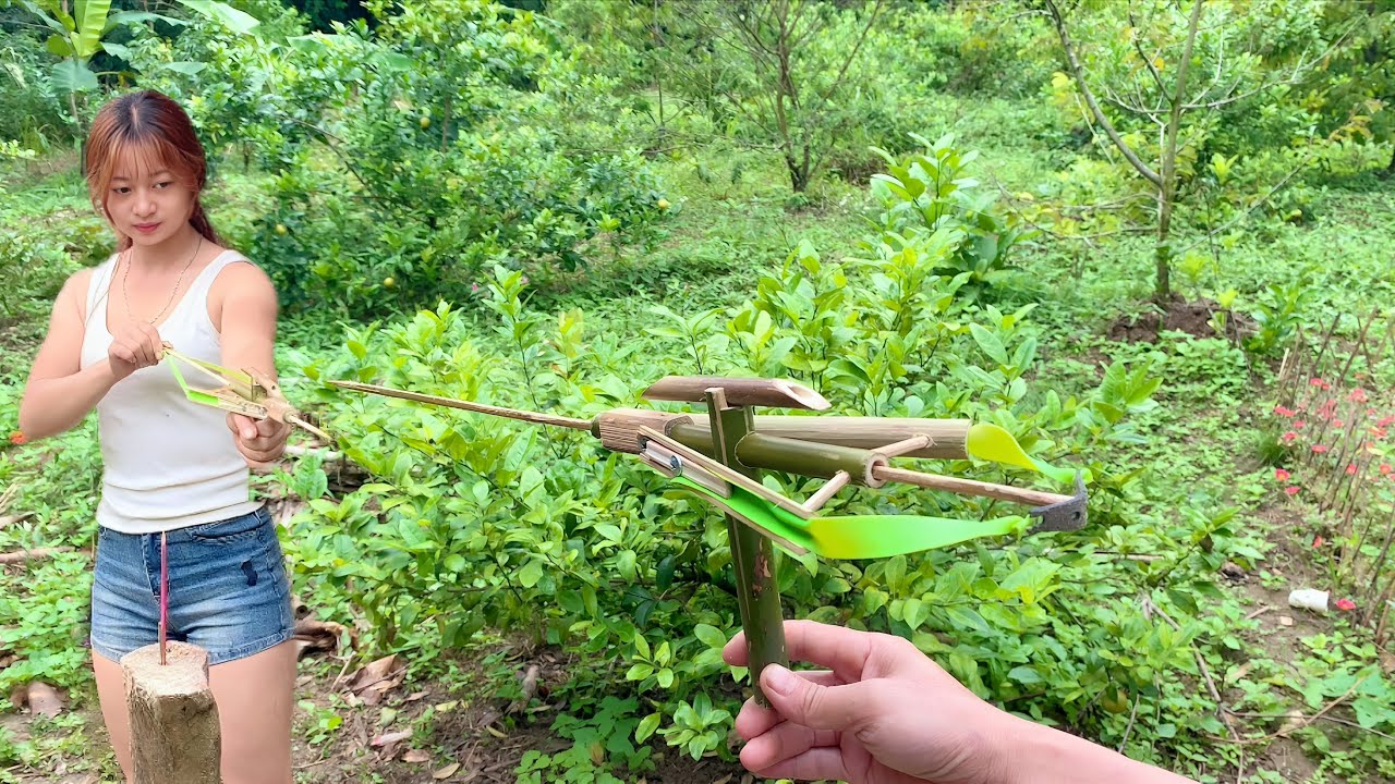Young girl makes crossbow from bamboo - new design by natalia