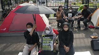 Rights activists in Indonesia stage protests as parliament bans sex outside marriage
