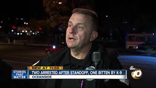 Two arrested after standoff, one bitten by K-9