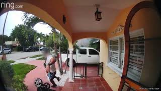 Guy walks into house then stroller rolls backways off ledge (Security camera)