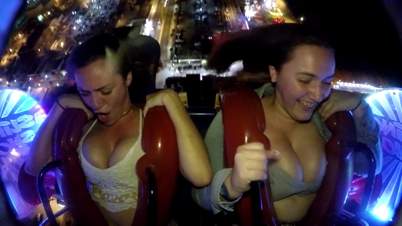 Boobs fall out on slingshot ride. 
