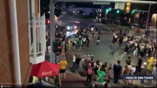 WATCH: Car drives through group of Iowa City protesters