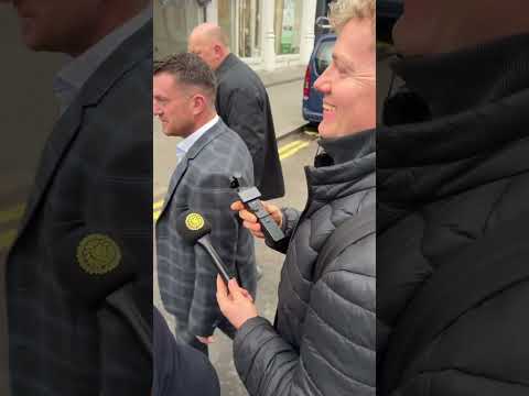 Tommy Robinson appears in court charged with terrorism for not giving his phone pin to the police