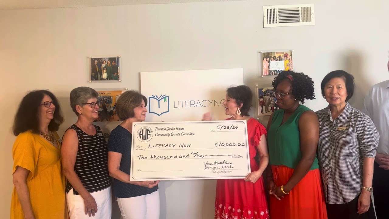 Literacy Now Receiving a Community Grant Check from the Houston Junior Forum