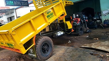 Xe công nông cầu đẩy của gara đông xuân lốp đôi, tời bụng sơn màu vàng rất là đẹp...