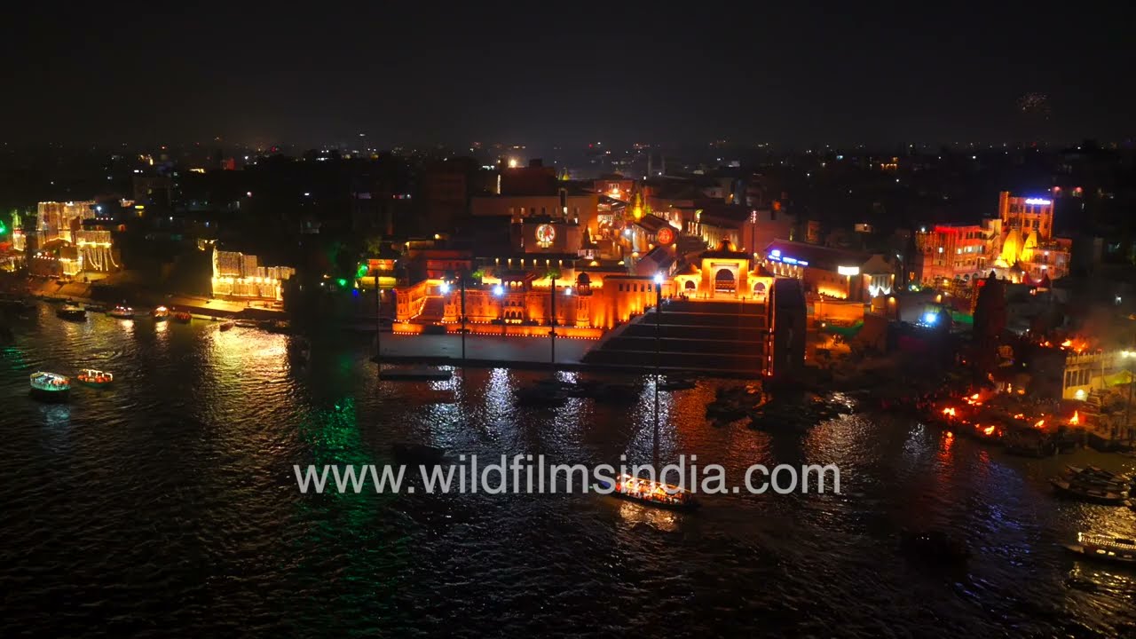 Manikarnika Ghat in Varanasi lit up during Dev Deepawali celebrations, cremation fires burn by night