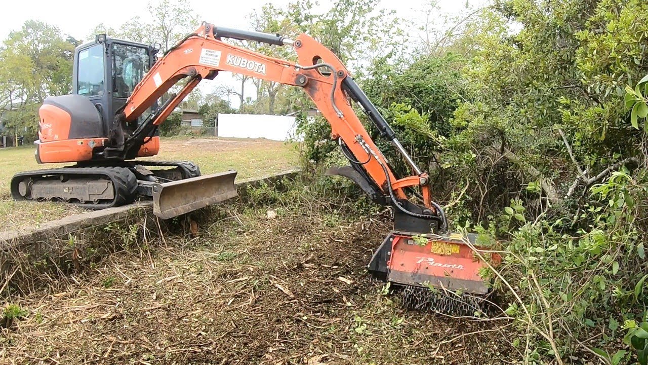 MUNCHIE GOT HUNGOVER! MULCHING OVER A FAILING RETAINING WALL!
