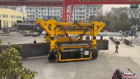 60T straddle carrier is transferring steel.#straddlecarrier