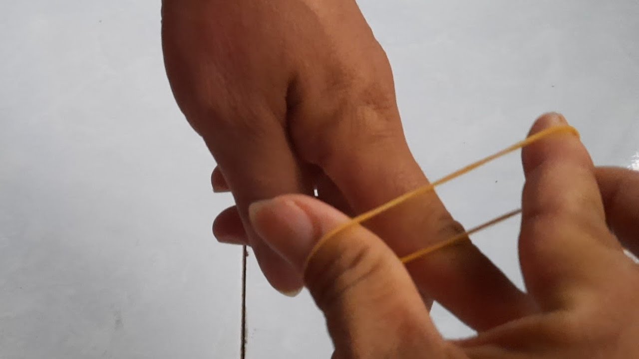 Ảo thuật dây thun xuyên ngón tay trỏ (hướng dẫn) - youtube