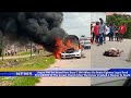 Angry mob set new benz ablaze on benin ugbowolagos road after driver crushed a woman to death