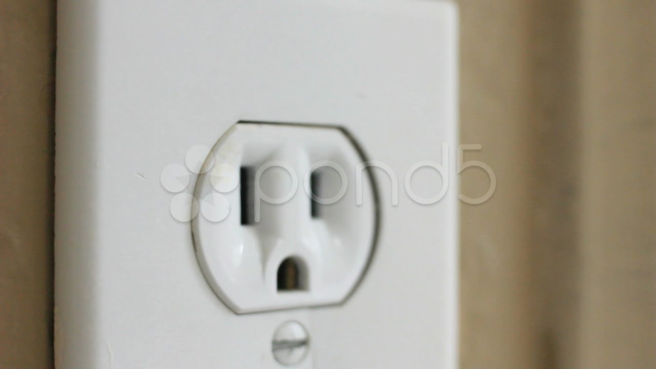 INSERT PLUG INTO WALL SOCKET. Stock Footage - YouTube