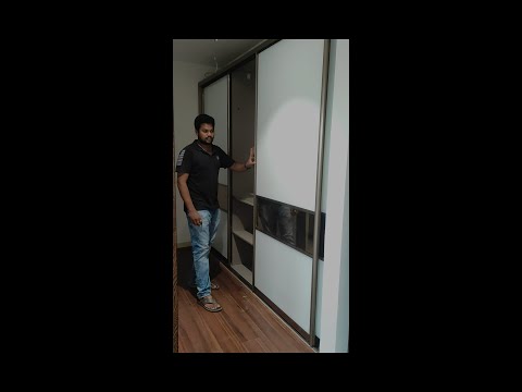 Video: Sliding doors for wardrobe: varieties and cost