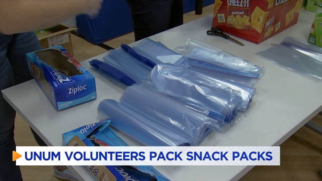 Unum employees prepare snack packs for local famillies YouTube