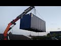 Crane operator lifts Shipping container over house!