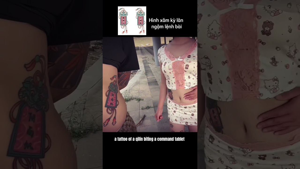 a tattoo of a qilin biting a command tablet