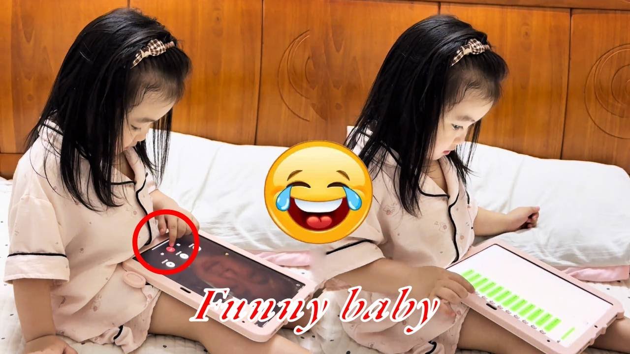 The baby is so funny, he hung up the phone with his dad just to listen to music