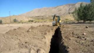 Caterpillar 420E backhoe skills demonstrated by Heo Quinonez