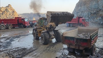 Powerful Loading Machine in Action: Caterpillar 966F Loading Rocks into Dump Trucks and Trolleys