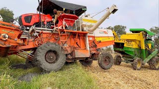 Kubota harvester stuck in mud Rescued by John Deere harvester